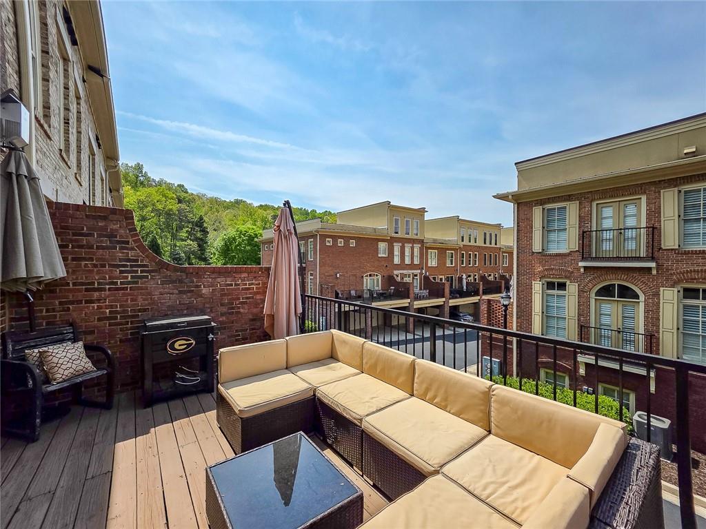 302 Riversgate Drive, Unit 55 Atlanta, GA 30339 - Photo 23 of 40 a view of a roof deck with couches chairs