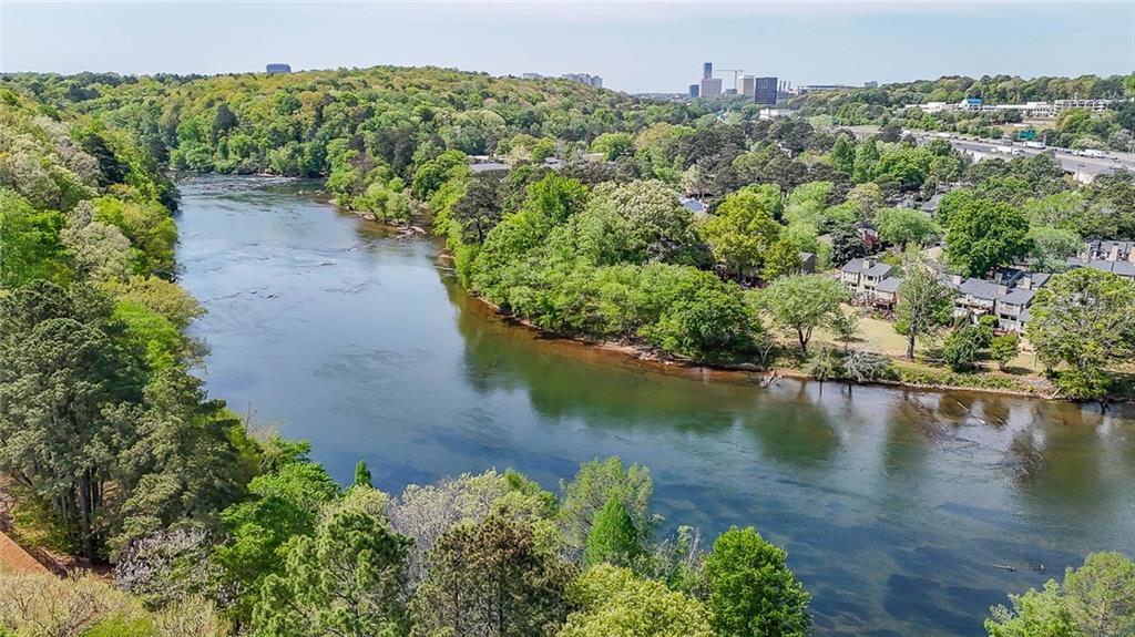 302 Riversgate Drive, Unit 55 Atlanta, GA 30339 - Photo 31 of 40 an aerial view of a house with a yard and lake view