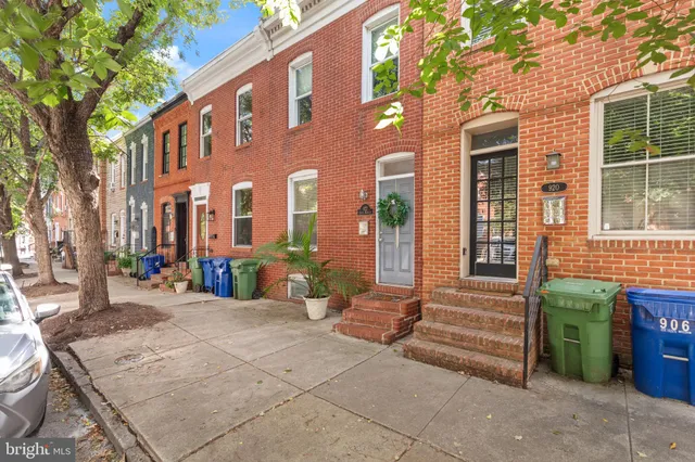 a view of a brick building with many windows