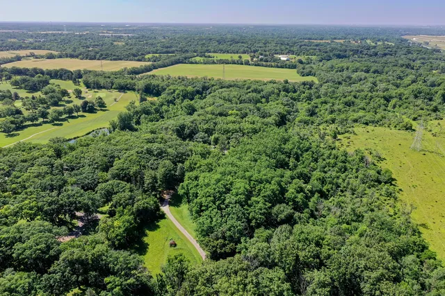 a view of a swimming pool with a yard