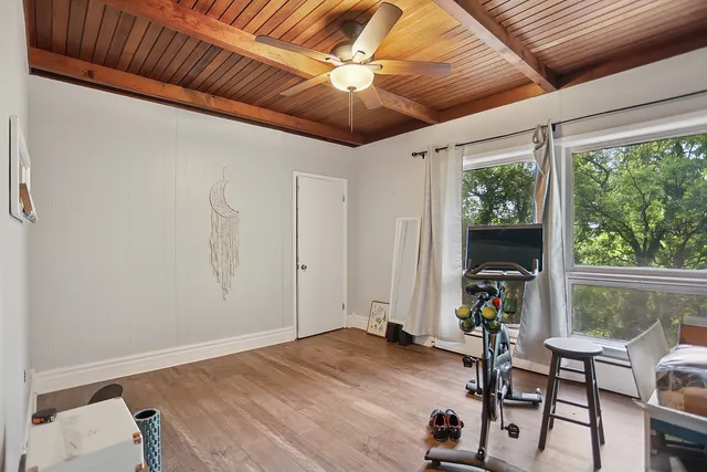 a view of a livingroom with furniture and a window