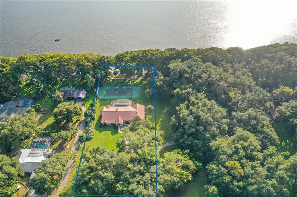 4345 Corley Island Road Leesburg, FL 34748 - Photo 1 of 1 Lake Harris Frontage, Tennis Court, Swimming Pool, Boat Dock with Guest Apartment on 1.66 Acres!