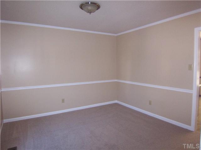 2417 Sawmill Road Raleigh, NC 27613 - Photo 12 of 16 This is bedroom #2 on front of house which features a nice walk-in closet.