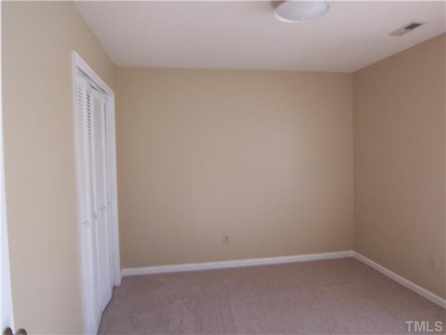 2417 Sawmill Road Raleigh, NC 27613 - Photo 13 of 16 This is bedroom #3 which looks out on the back yard. Note the nice double closet.