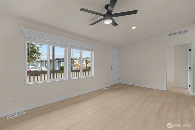 a view of an empty room with a window