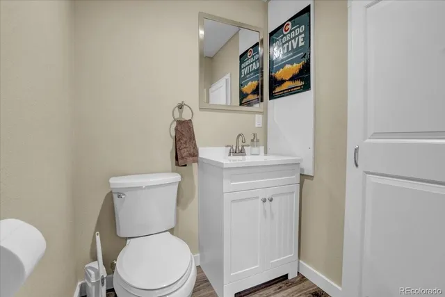 a white toilet sitting next to a bathroom sink