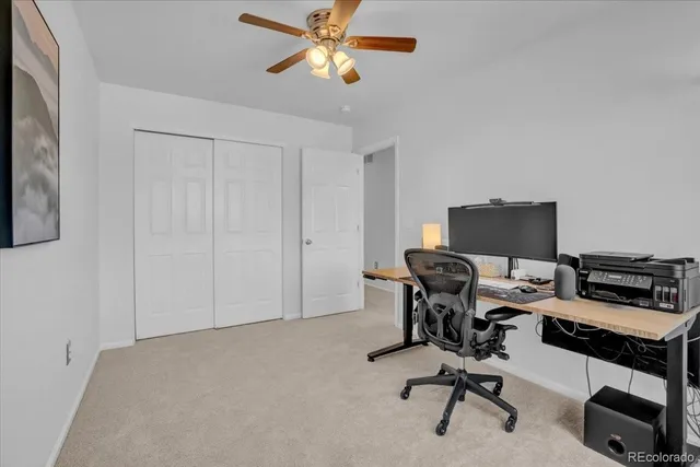 a view of a workspace with furniture