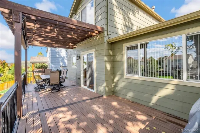 a view of living room with furniture and floor to ceiling windows