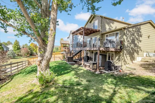 a view of a park with iron fence