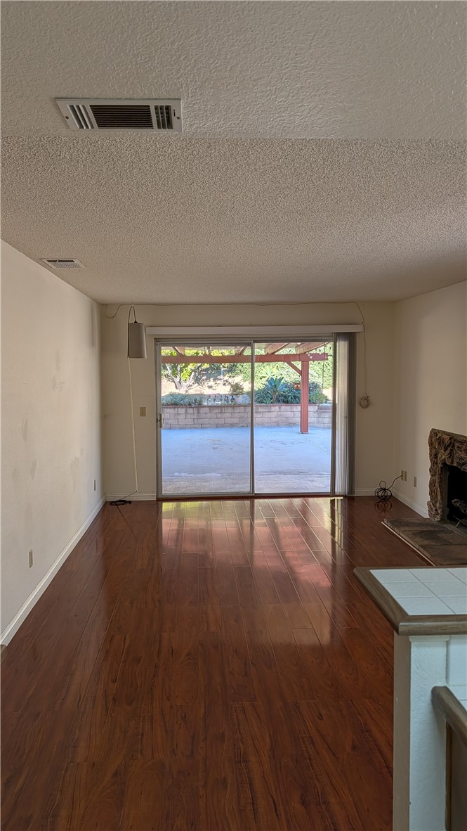 19143 East Aurora Drive Walnut, CA 91789 - Photo 11 of 27 an empty room with wooden floor and windows