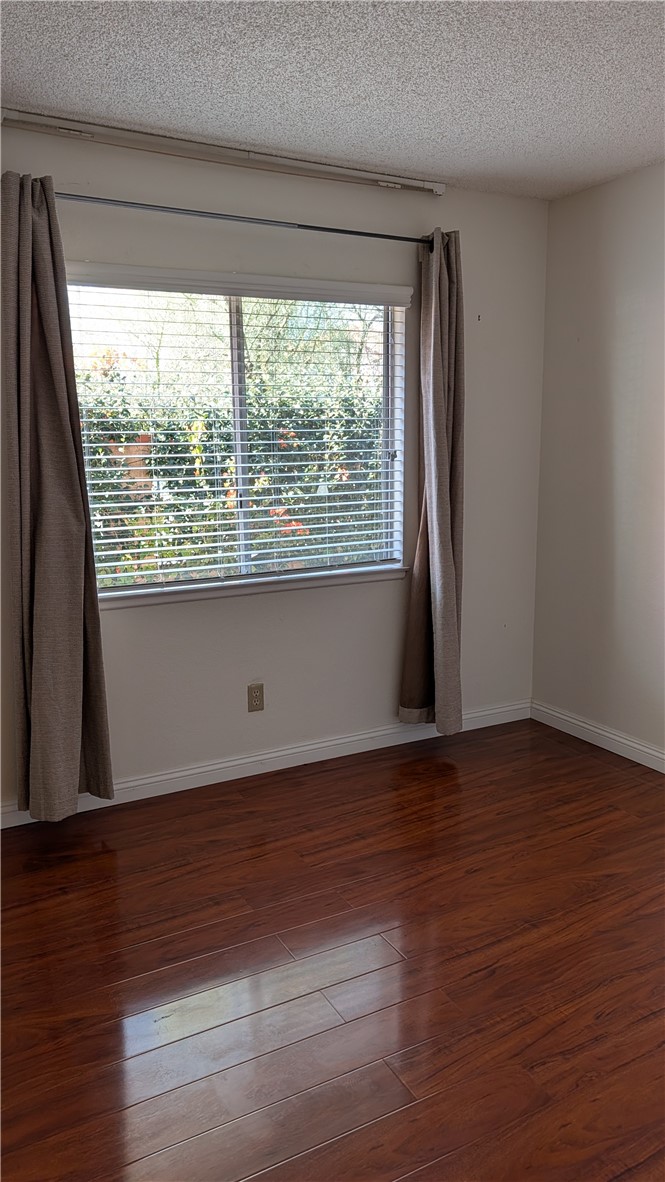 19143 East Aurora Drive Walnut, CA 91789 - Photo 15 of 27 a view of an empty room with wooden floor and a window