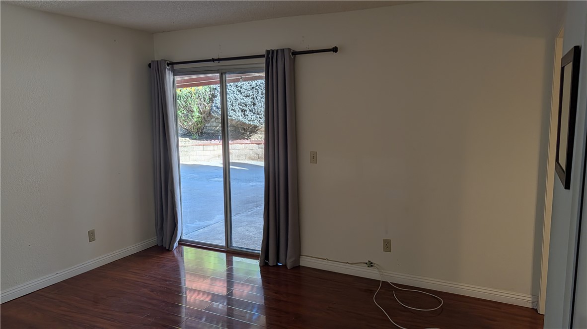 19143 East Aurora Drive Walnut, CA 91789 - Photo 18 of 27 a view of an empty room with wooden floor and a window