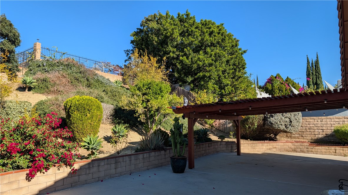 19143 East Aurora Drive Walnut, CA 91789 - Photo 6 of 27 a view of a porch with furniture and a potted plant