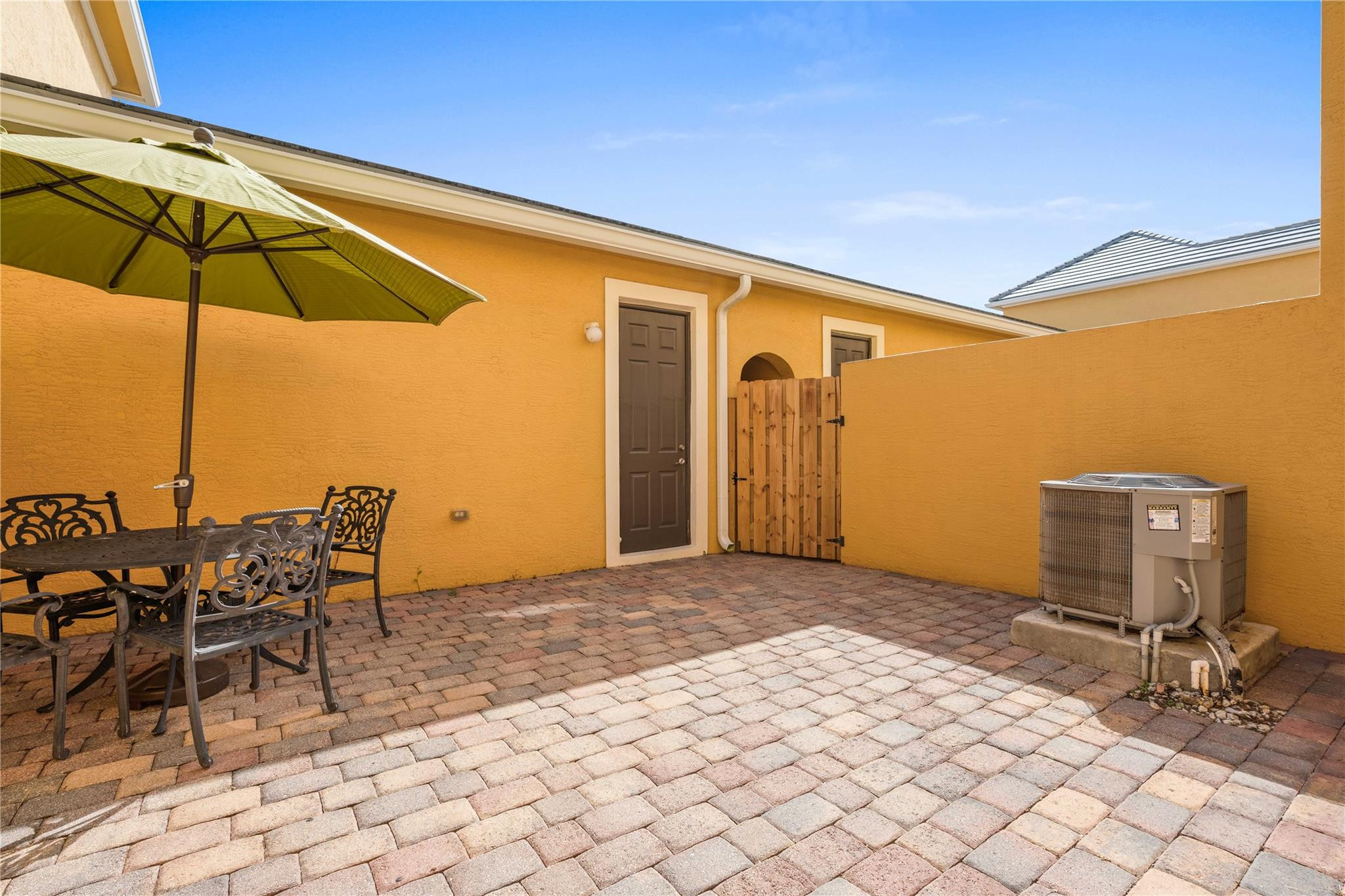 147 Midleton Way, Unit 244 Jupiter, FL 33458 - Photo 40 of 44 Pavered Courtyard to Garage