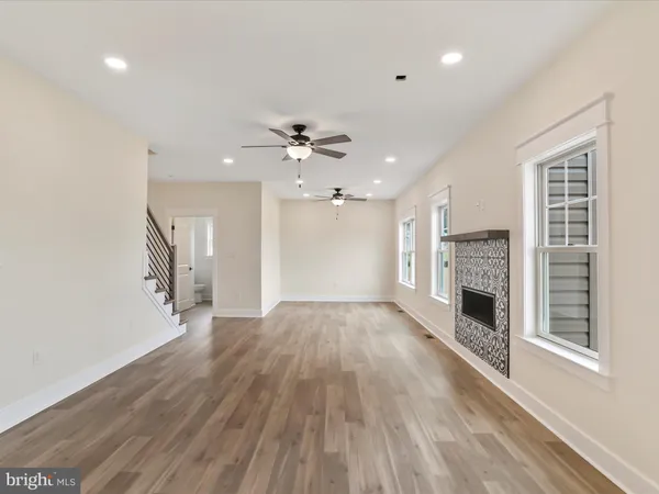 a view of open kitchen with furniture and fireplace