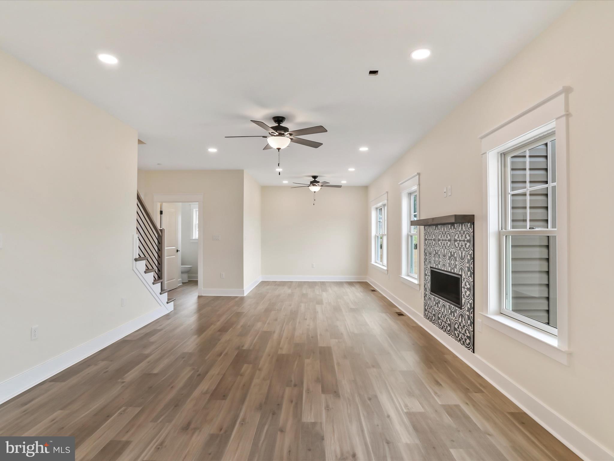 0 Paradise Church Road Hagerstown, MD 21742 - Photo 13 of 59 an empty room with wooden floor fireplace and windows