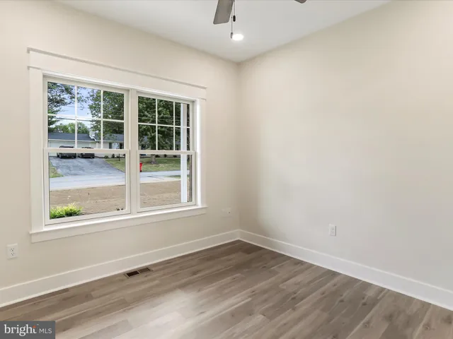 a view of a hallway with stairs