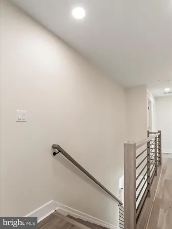 a view of a livingroom with a ceiling fan and window