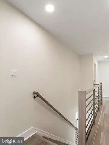 a view of a livingroom with a ceiling fan and window
