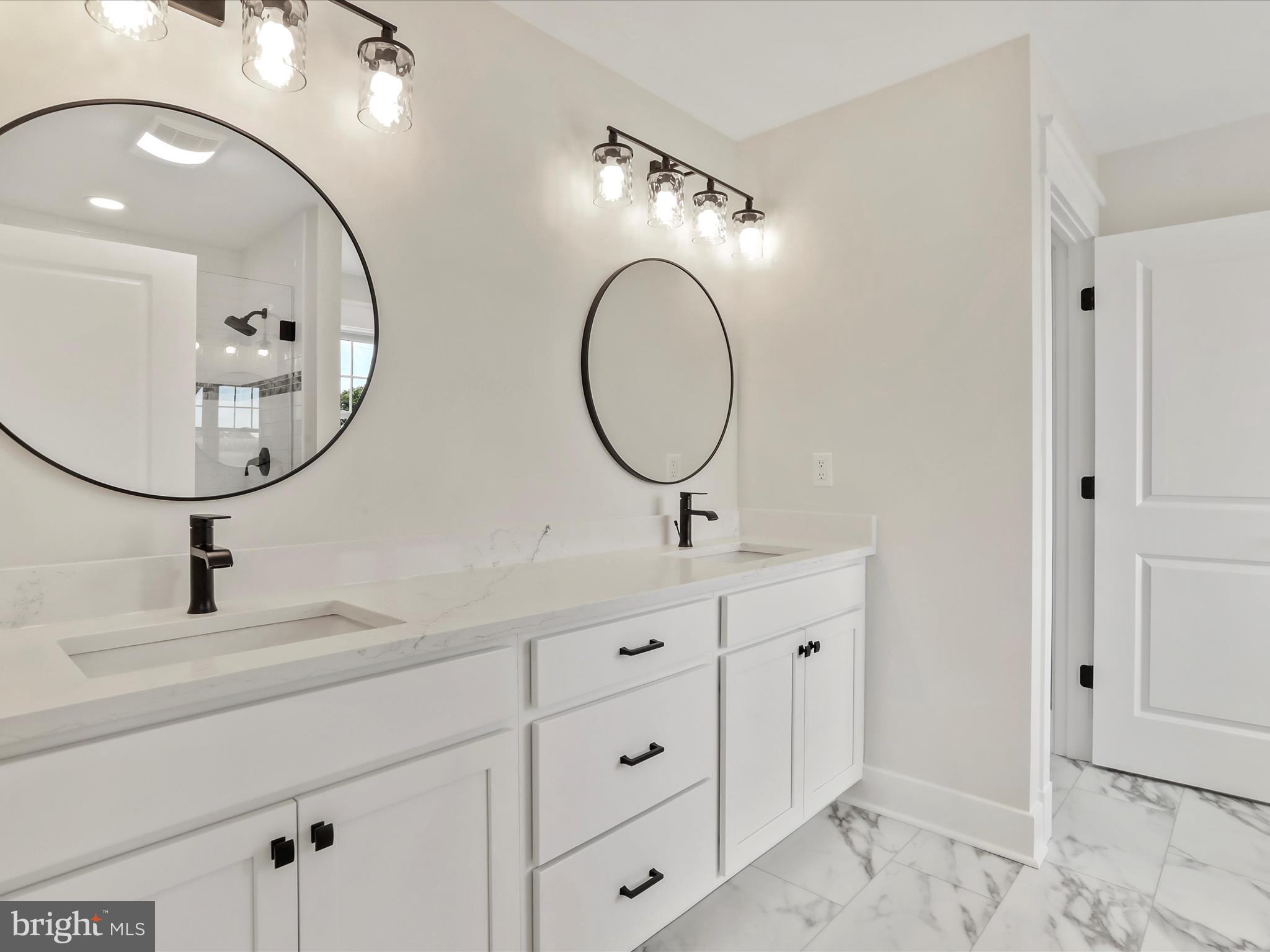 0 Paradise Church Road Hagerstown, MD 21742 - Photo 31 of 59 a bathroom with double vanity sinks and a mirror