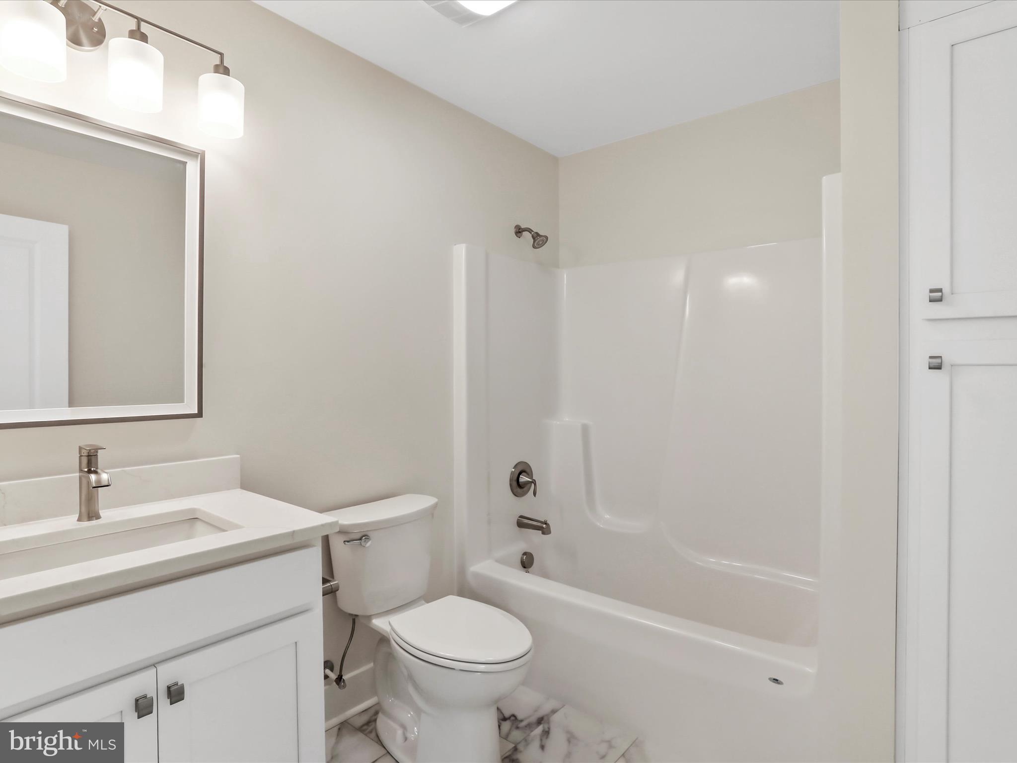 0 Paradise Church Road Hagerstown, MD 21742 - Photo 36 of 59 a bathroom with a bathtub shower sink vanity mirror and toilet