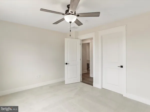 en view of a chandelier fan in a room