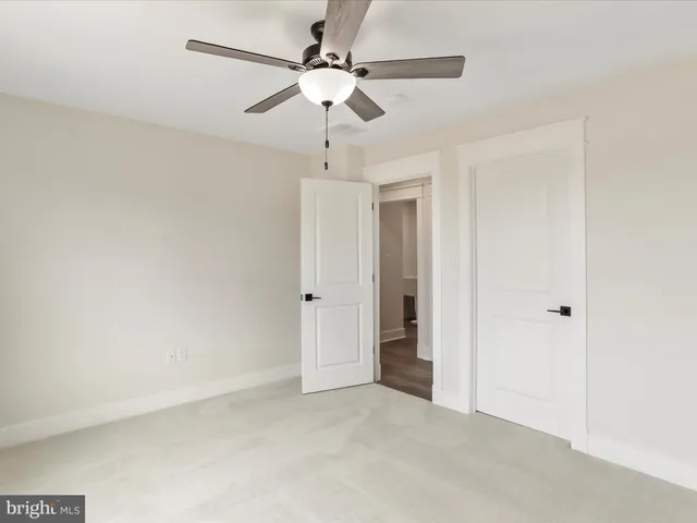 en view of a chandelier fan in a room