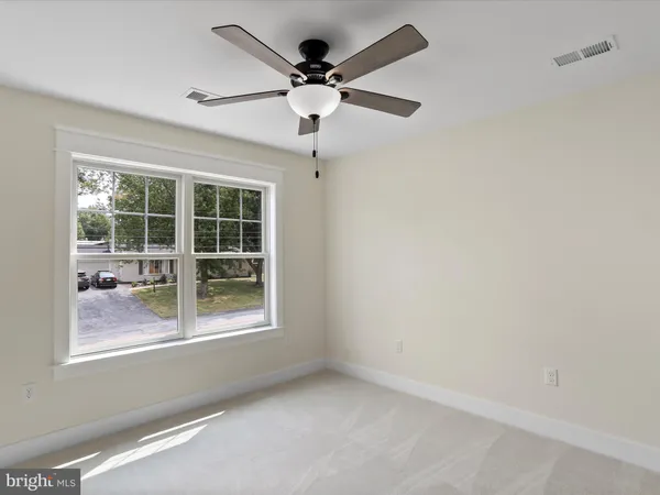 a bathroom with a sink a mirror and shower
