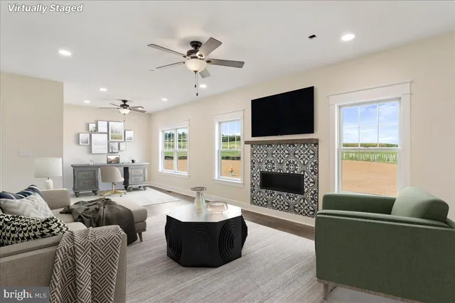 a view of an empty room with a fireplace and a window