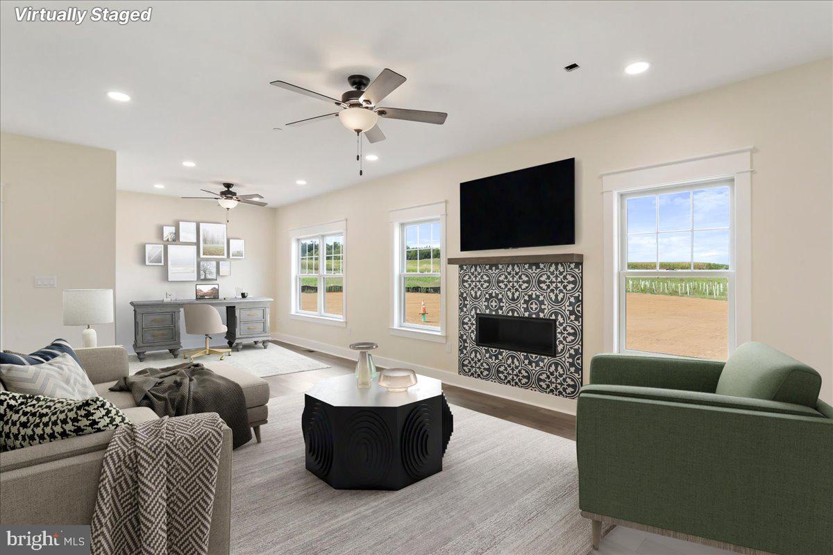 0 Paradise Church Road Hagerstown, MD 21742 - Photo 10 of 59 a living room with furniture a fireplace and a flat screen tv