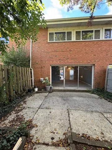 a front view of a house with a yard and a garage