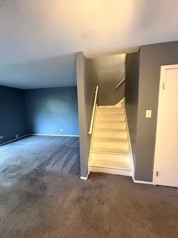 a view of entryway with stairs