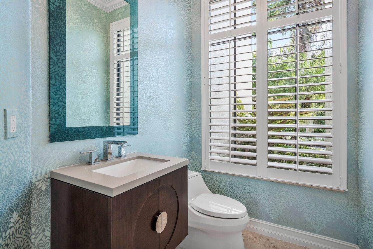 17657 Middlebrook Way Boca Raton, FL 33496 - Photo 24 of 98 a bathroom with a sink a toilet and a mirror