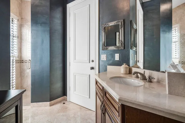 a view of a house with swimming pool and sitting area