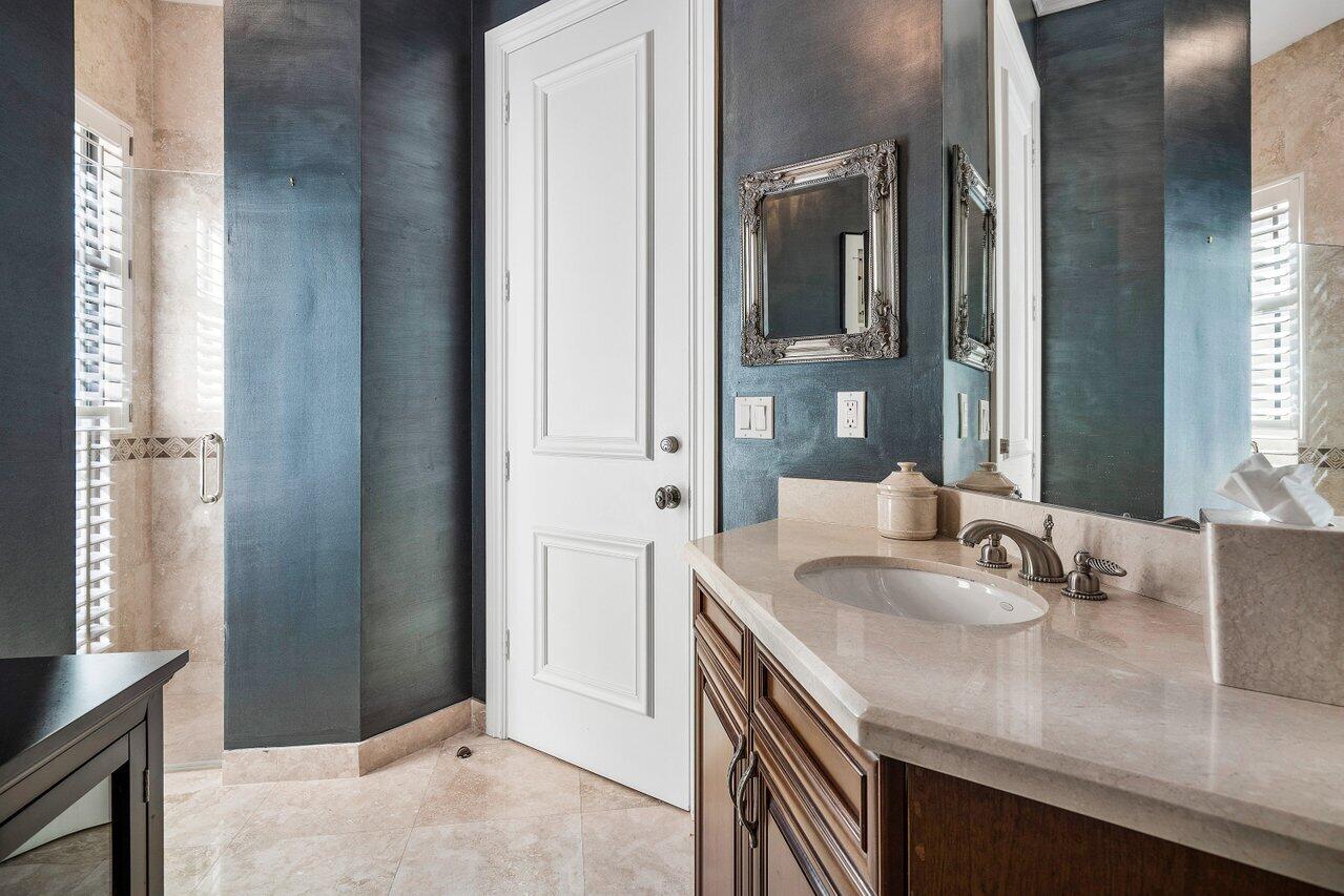 17657 Middlebrook Way Boca Raton, FL 33496 - Photo 27 of 98 a bathroom with a sink and a mirror