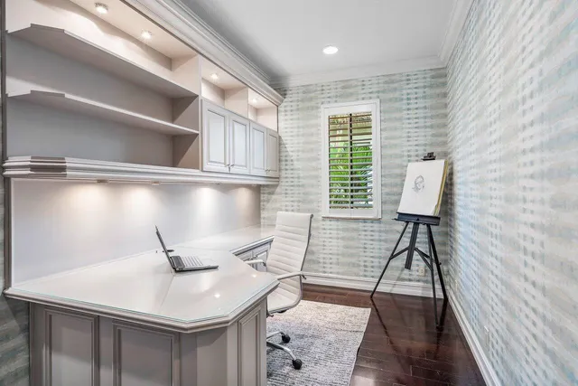 an aerial view of a house with a lake view