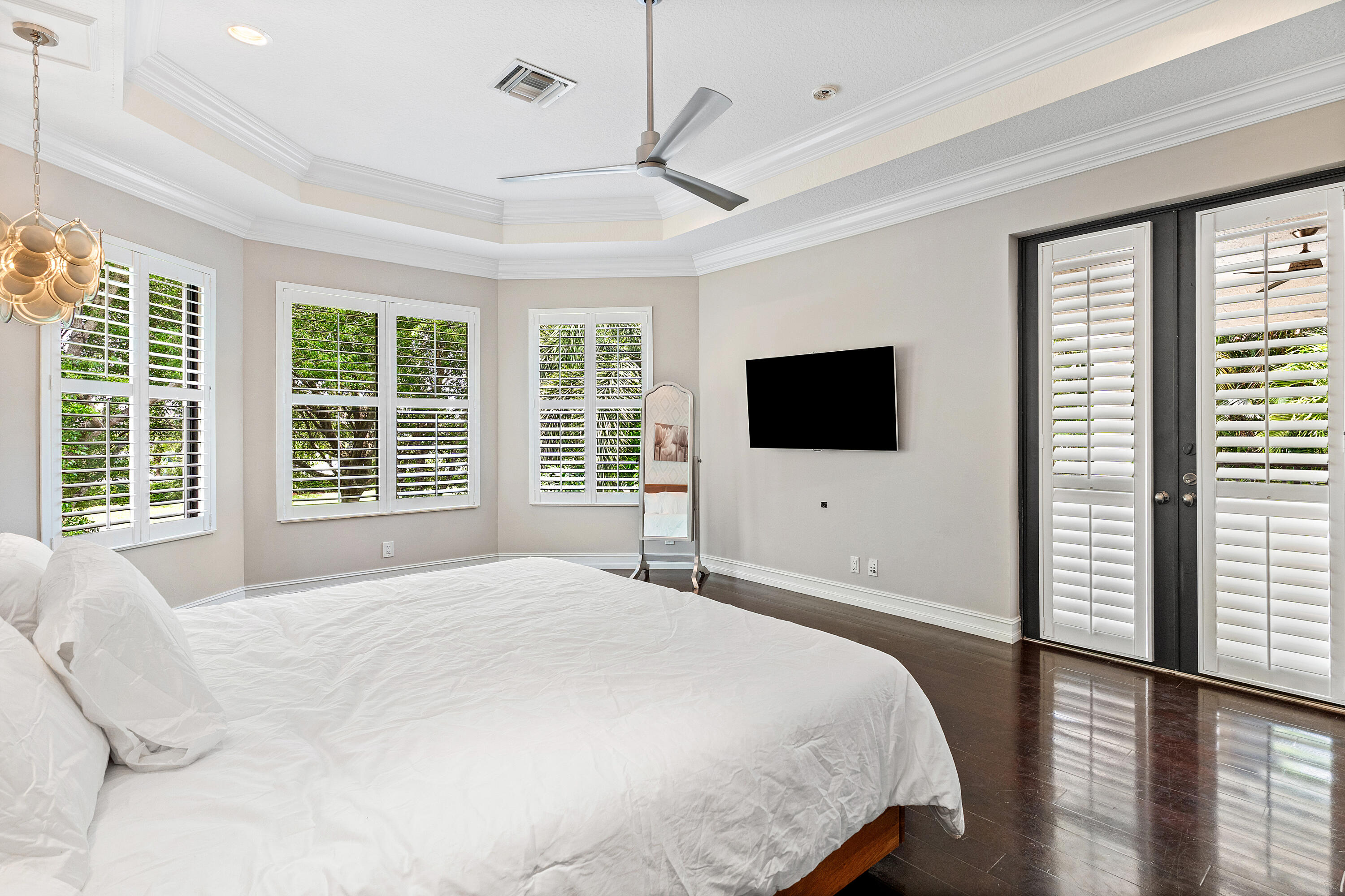 17657 Middlebrook Way Boca Raton, FL 33496 - Photo 34 of 98 a bedroom with a bed tv on table and a large window