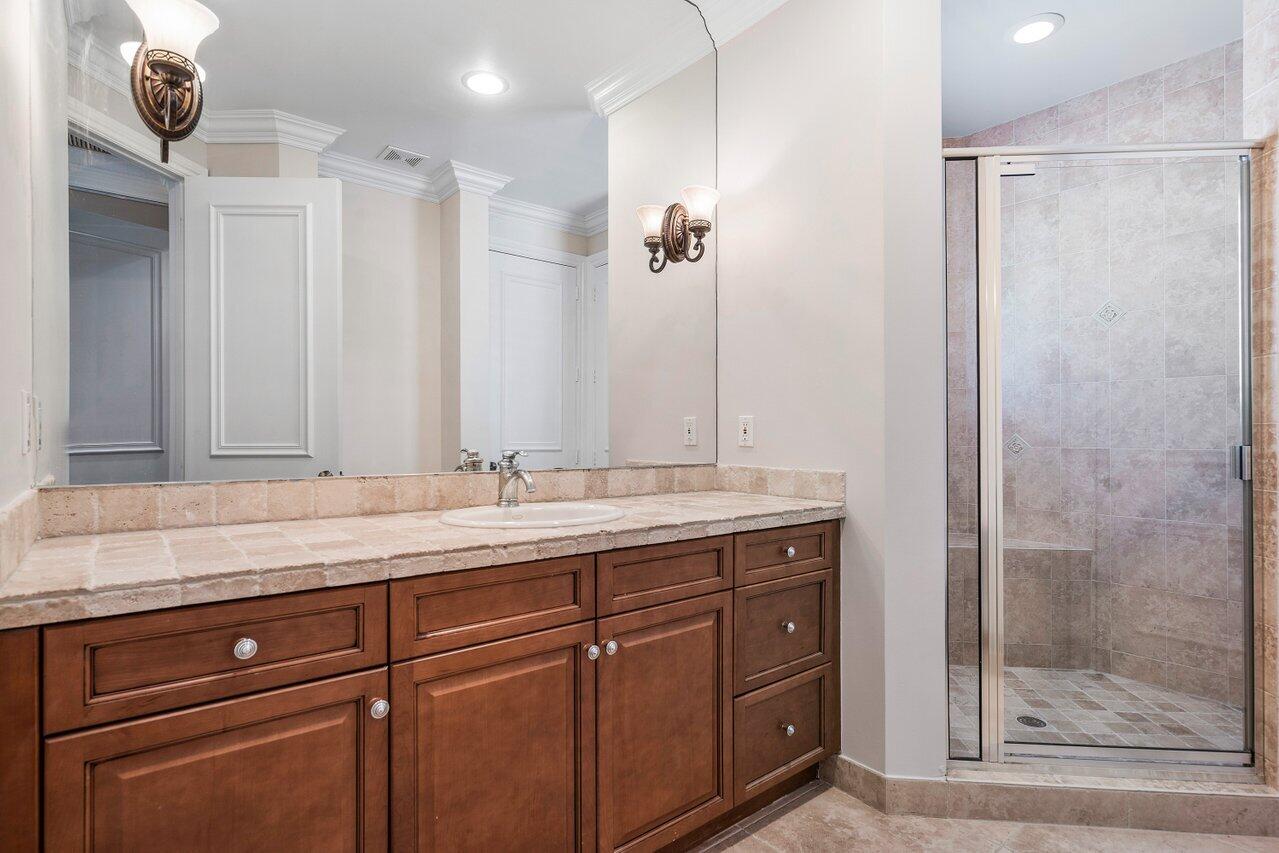 17657 Middlebrook Way Boca Raton, FL 33496 - Photo 48 of 98 a bathroom with a granite countertop sink a mirror and shower