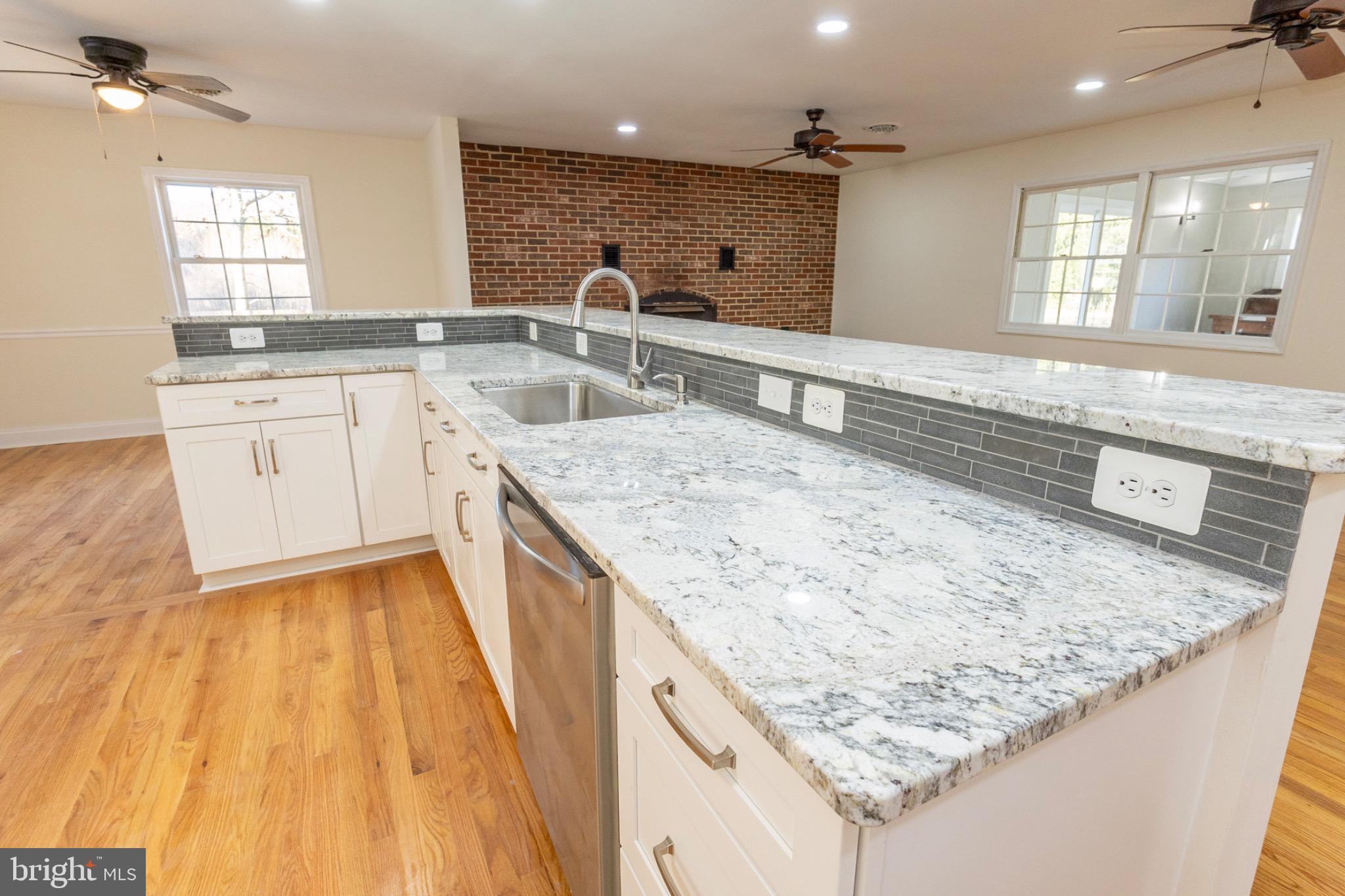 49151 Wynne Road Ridge, MD 20680 - Photo 14 of 80 Modern kitchen with elegant granite countertops.