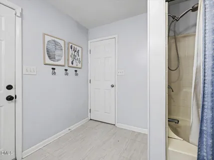 a spacious bathroom with a toilet sink and mirror