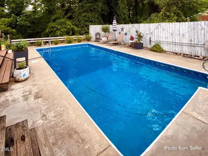 a view of swimming pool with lounge chair