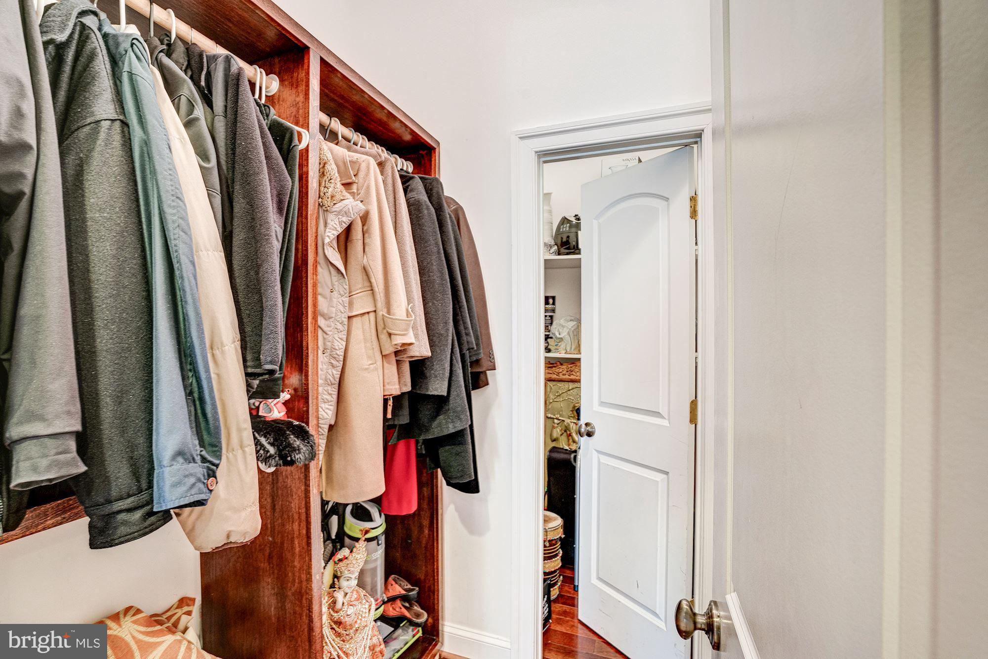 946 Seneca Road Great Falls, VA 22066 - Photo 32 of 106 Main level coat closet leading to the pantry.