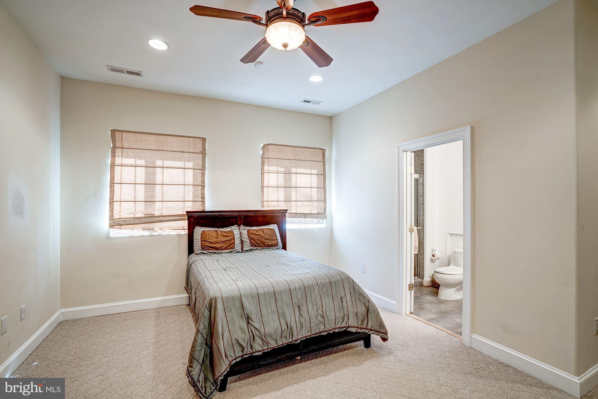 946 Seneca Road Great Falls, VA 22066 - Photo 92 of 106 5th bedroom in the basement with a full bath.
