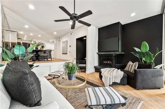a view of a livingroom with furniture and a kitchen