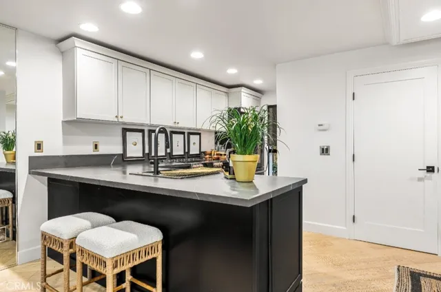 a kitchen with a sink and cabinets