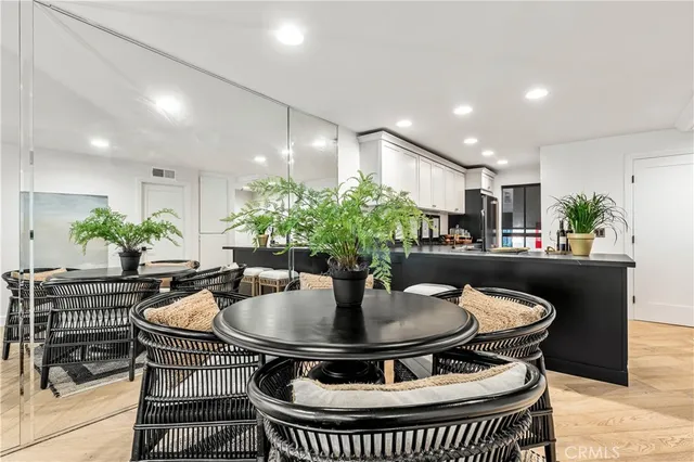 a kitchen with a dining table and chairs