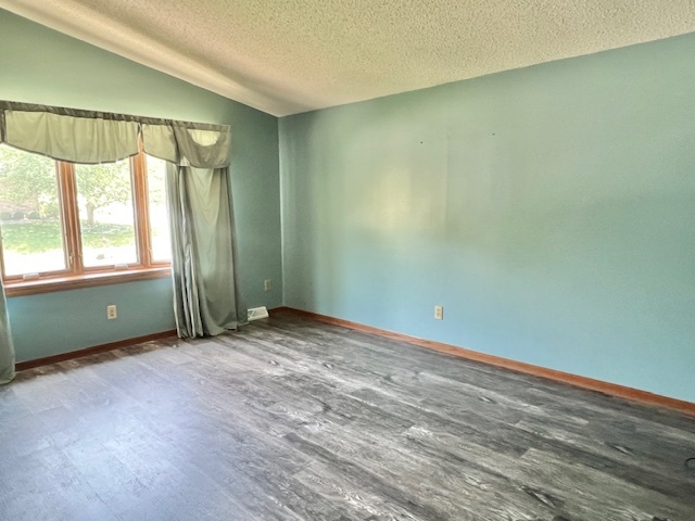 333 Fox Trot Dixon, IL 61021 - Photo 5 of 21 an empty room with wooden floor and windows