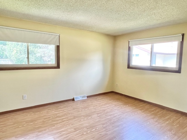 333 Fox Trot Dixon, IL 61021 - Photo 8 of 21 a view of an empty room with wooden floor and a window
