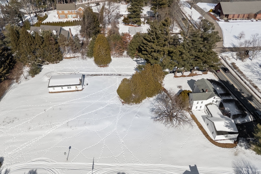 87 Landham Road Sudbury, MA 01776 - Photo 3 of 16 an aerial view of a house with outdoor space