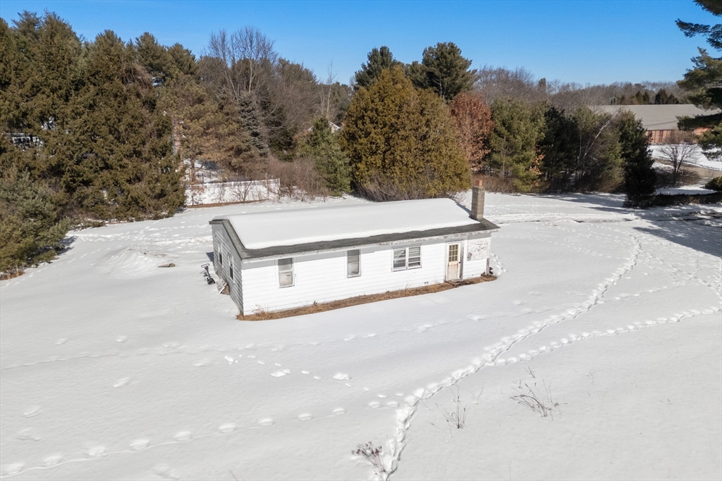 87 Landham Road Sudbury, MA 01776 - Photo 4 of 16 a view of a street with a building in the background